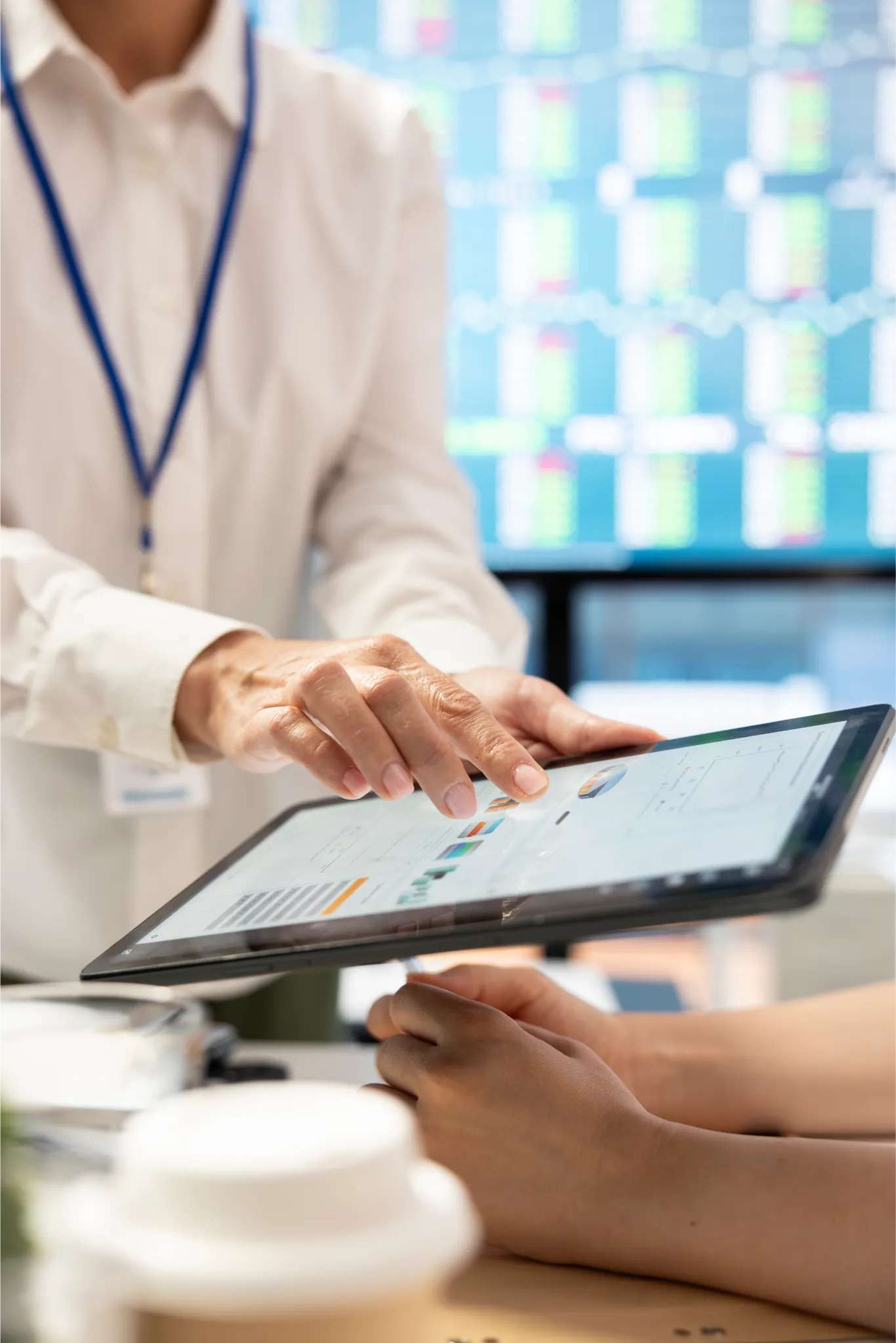 Clinician showing lab data on a tablet