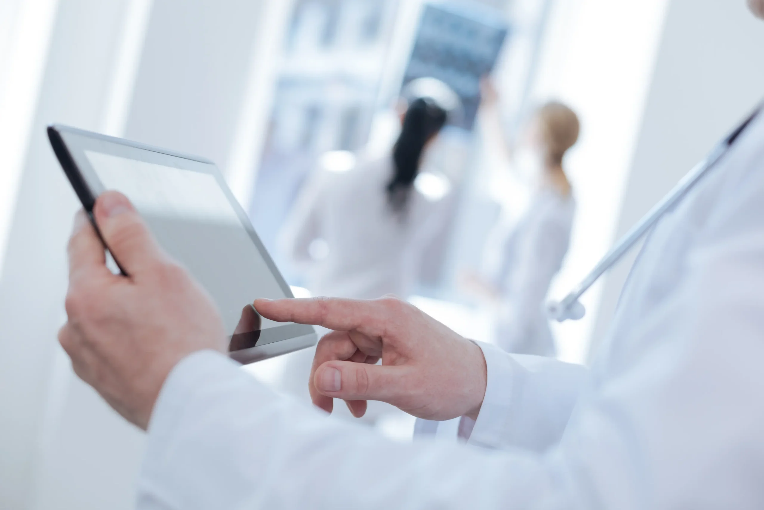 Provider making notes on a tablet