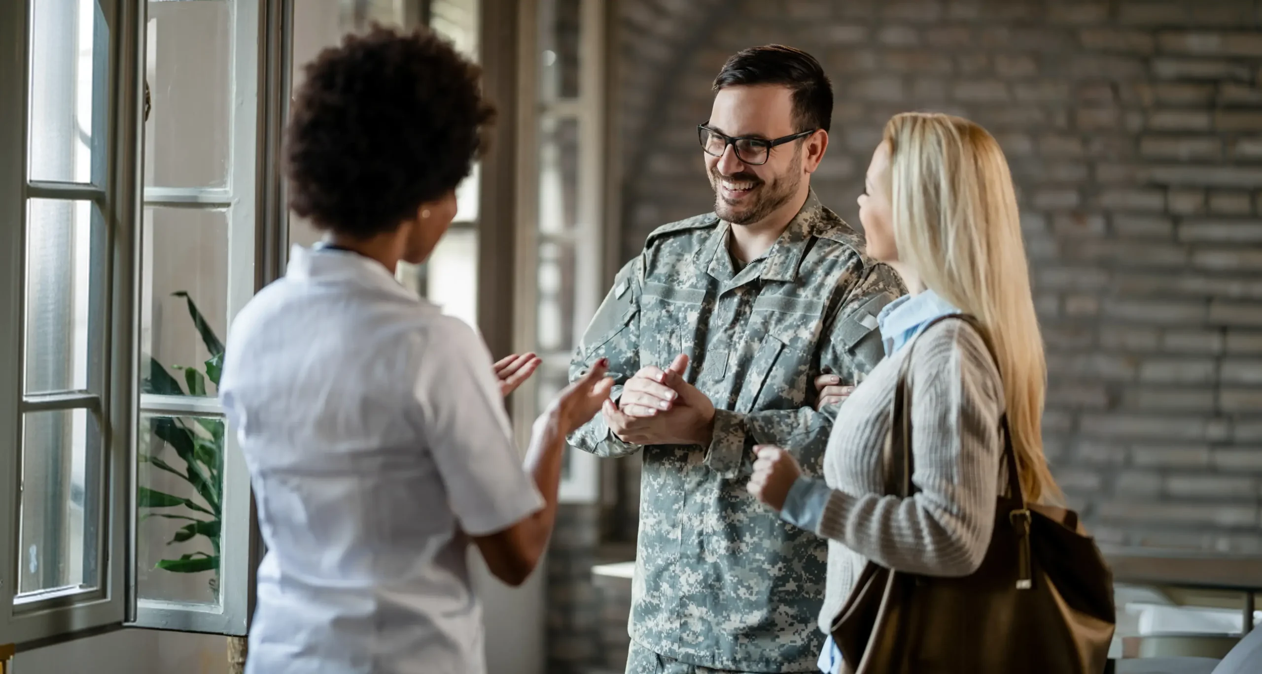 Clinician talking with a service member and their family